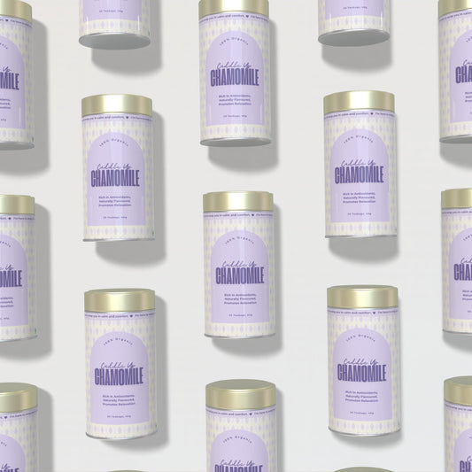 Multiple tins of 'Cuddle Up Chamomile' on a light background