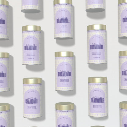 Multiple tins of 'Cuddle Up Chamomile' on a light background